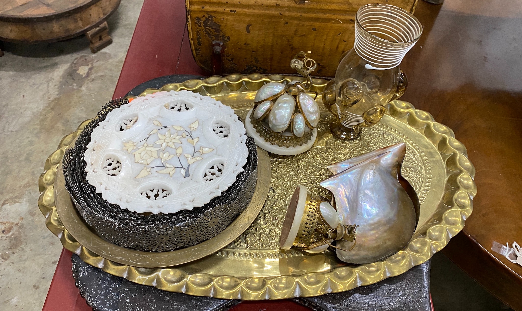 A Victorian tin trunk, a painted leather banner, an oval Indian brass tray and sundries.
